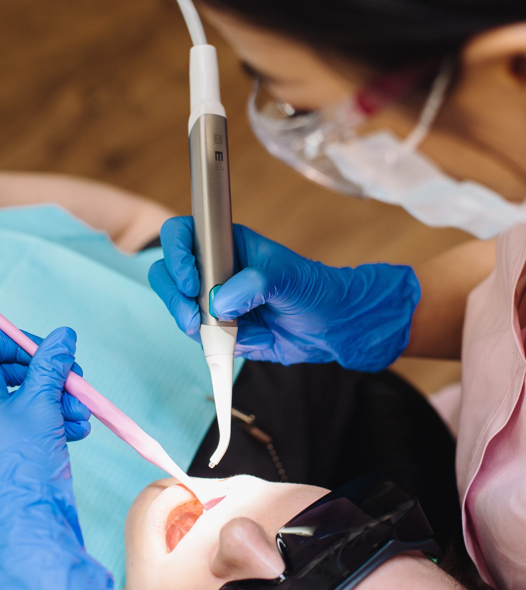 pink dental instrument during check up