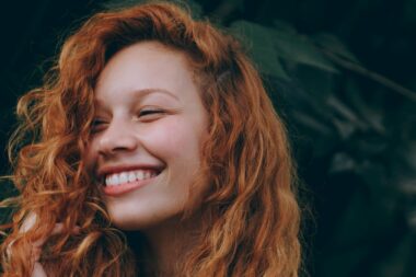 young red-headed woman smiling